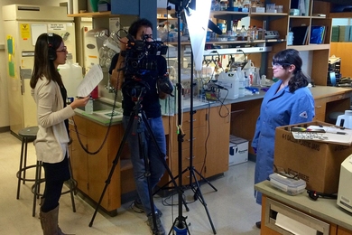 Left to right: Elizabeth Choe ’13, executive producer; George Zaidan ’08, director; and Whitney Hess PhD '16 film “Choose-Your-Own-Chemistry-Adventure” for “Science Out Loud” from MIT+K12 Videos.
