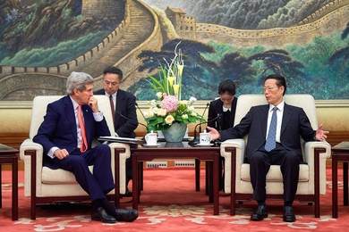 Zhang Gaoli (seated, right), vice premier of China, whose portfolio includes environmental issues, speaks with U.S. Secretary of State John Kerry at the outset of a meeting about climate change and other topics at the Great Hall of the People in Beijing, China, on Nov. 11, 2014. 