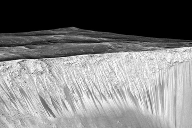 Mars’ Valles Marineris canyon, pictured, spans as much as 600 kilometers across and delves as much as 8 kilometers deep. The image was created from over 100 images of Mars taken by Viking Orbiters in the 1970s.
