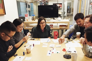 STL Lab and MIT Game Lab project participants work together to develop and test a socially responsible real estate game.