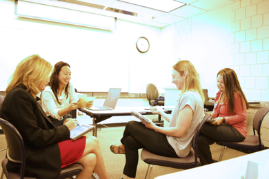MIT team members and Arapahoe Community College faculty test out the Fly-by-Wire Student App on classroom iPads.