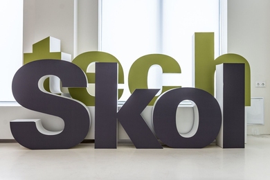 The text "tech Skol" in 3D letters in hallway