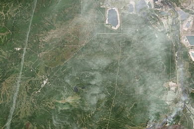 A destructive wildfire burned through Canada’s Northern Alberta region, razing neighborhoods in Fort McMurray and displacing tens of thousands of residents. 