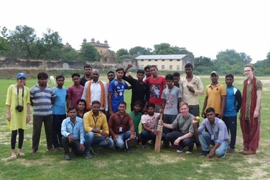 “You could think of the cricket pitch as a microcosm of caste issues in India,” says Matt Lowe (bottom, second from right), a PhD candidate leading a study in India to see if the popular game of cricket can help bridge caste divides.