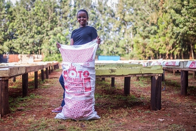 D-Lab Scale-Ups Fellow Chebet Lesan holds a bag of her company's innovative charcoal briquettes, which are made from recycled waste. Lesan is the founder and CEO of BrightGreen Renewable Energy, which provides affordable, clean, safe, and eco-friendly charcoal briquettes for low-income households in Kenya. 