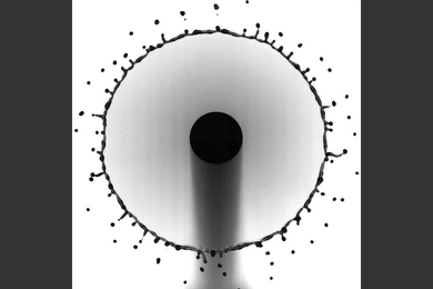 A droplet, splashing onto the tip of a very thin rod, produces a rim of fluid that sprays smaller droplets as it expands.