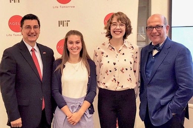 MIT AgeLab’s Joe Coughlin (right) and AARP’s Michael Festa (left) present OMEGA Scholarship awards to Rachel Schultz and Marley Belanger. Not pictured: Caroline Collins-Pisano. 
