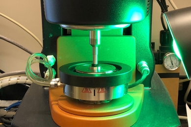 An instrument called a rheometer can measure mechanical properties of materials. The blue-colored gel on the stage of the instrument is the material. The rheometer is used to measure the modulus of the material, to gain an understanding of its stiffness and degree of dynamics.