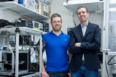 Associate Professor A. John Hart (right), doctoral student Adam Stevens SM ’15, and their colleagues have designed a 3-D printer that can deposit material 10 times faster than today’s desktop models can. The team has also developed a novel process for 3-D printing using cellulose, a widely available natural polymer.