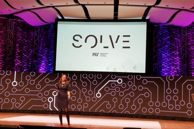 Alex Amouyel announces the 2019 Solve Global Challenges on stage in Kresge Auditorium at the Hello World, Hello MIT event.
