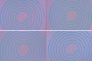 MIT researchers have developed a technique to grow 2-D materials directly onto patterned substrates (shown here) and then recycle the patterns for faster, simpler chip manufacturing.