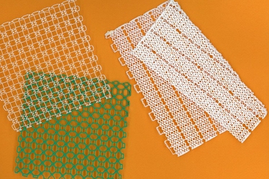 MIT engineers 3-D-print stretchy mesh, with customized patterns designed to be flexible yet strong, for use in ankle and knee braces.