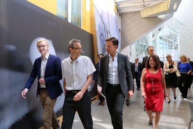Prime Minister Mark Rutte of the Netherlands, second from right, front, along with a large Dutch delegation, visits MIT’s Computer Science and Artificial Intelligence Laboratory (CSAIL) at the Ray and Maria Stata Center on July 19. MIT Professor Frans Kaashoek of CSAIL is second from the left.