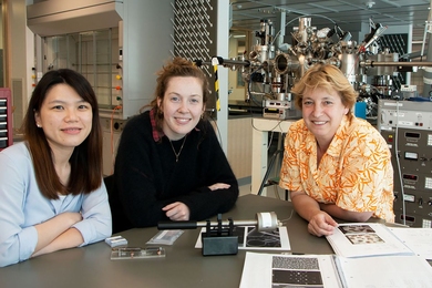 Left to right: Postdoc Shu Fen Tan, graduate student Kate Reidy, and Professor Frances Ross, all of the Department of Materials Science and Engineering, sit in front of a high vacuum evaporator system. 