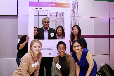 The MIT Society of Women Engineers executive board poses for a picture with their faculty advisor, Professor Sangeeta Bhatia (top left) and Dean of Engineering Anantha Chandrakasan (top middle).
