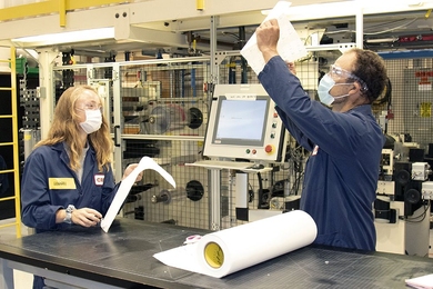 3M is collaborating with the lab of MIT Associate Professor Hadley Sikes to jointly develop a rapid Covid-19 test. Here, 3M Covid-19 test team members work in a pilot lab facility.