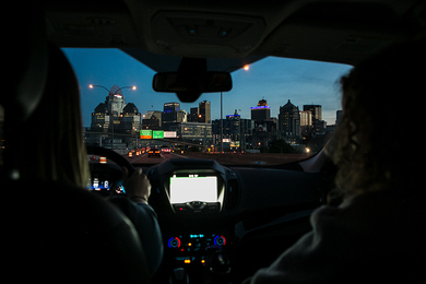 View of driver and passenger looking out windshield of a car