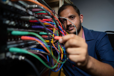 Photo of Arghya Mukherjee manipulating circuits