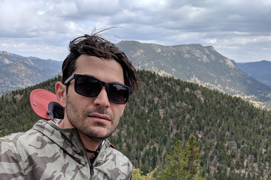 Photo of Eaman Jahani with mountains behind him
