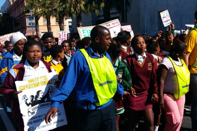 Individuals marching and protesting peacefully