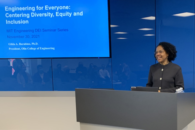 Gilda Barabino stands at a podium. On a screen behind her, the words: "Engineering for Everyone: Centering Diversity, Equity and Inclusion"
