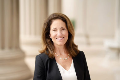 Cynthia Barnhart among the columns of MIT's Killian Court