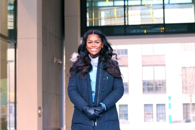 Photo of Rachel Myers outdoors in a winter jacket and gloves