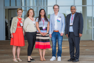 Group photo of 5 members of the MIT-Takeda Program leadership and administration at a program event