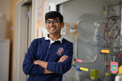 Ashutash Kumar stands with arms folded in the lab
