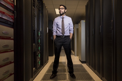 Vijay Gadepally stands in the Lincoln Laboratory Supercomputing Center