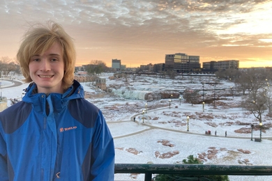 Titus Roesler stands in front of a snowy landscape in Sioux Falls, South Dakota