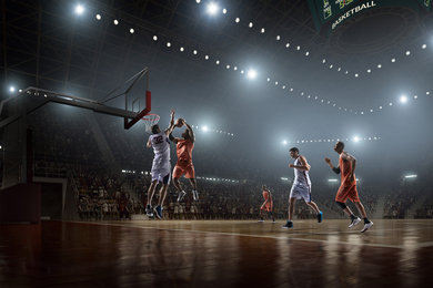 Professional basketball players playing a game of basketball