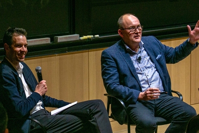 John Hart and Carsten Rasmussen sit at the front of an MIT lecture hall.