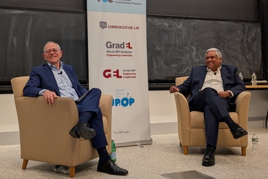 L. Rafael Reif and Anantha Chandrakasan sitting in easy chairs and smiling
