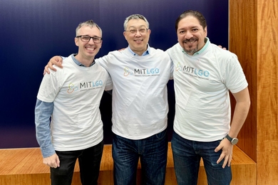 Chuck Cummings, John Tagawa, and Diego Méndez de la Luz pose together wearing the same MIT LGO t-shirts