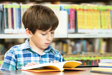 A young boy reading