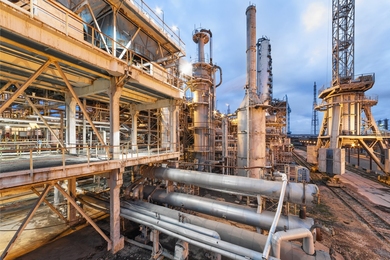 External view of an ammonia production plant, a huge industrial facility with many pipes, vents, and containers