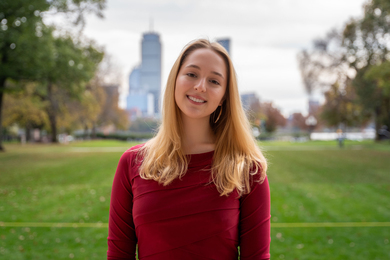 Julia Schneider in Killian Court with Boston skyline in background