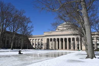 MIT's Dome with snow and ice on the lawn in front