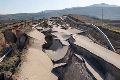 A undulating, destroyed highway.