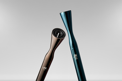 Two sleek metallic cylindrical torches, each with a flare at the end. One is gray and one is teal.