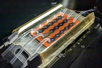 A device with three rows, with tubes attached on both ends.