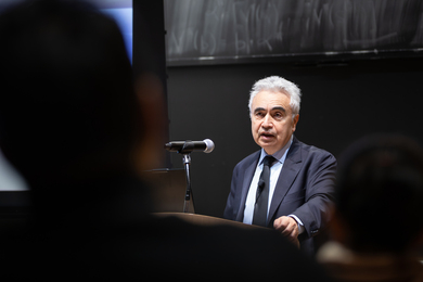 Fatih Birol speaks at an indoor lectern